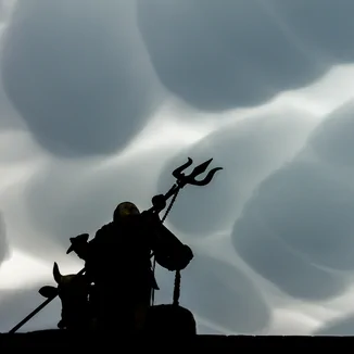 Hindu god Shiva and mammatus cloud. This picture is available at Picfair (downloads and prints). Copyright: Radek Kucharski.